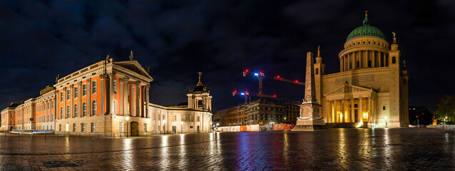 Fototapeta premium POTSDAM, GERMANY - October 15 2022: Night illumination of the construction site on the Old Market Square, Saint Nicholas Church.