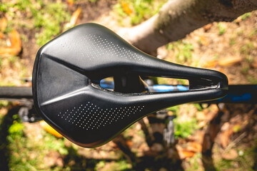 Details of the saddle of a pro bike in the park in a sunny day