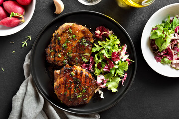 Roasted pork steak with vegetable salad