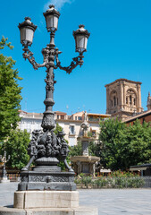 Fototapeta na wymiar Disparo vertical en la plaza de Bib Rambla en la ciudad de Granada con campanario de la catedral al fondo, España