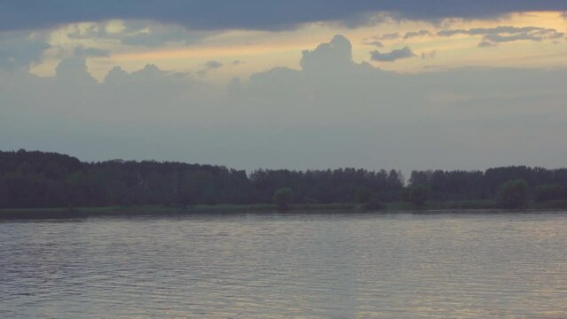 lake in the evening after sunset. Quiet lake after sunset. Steam rising from the water. 4k