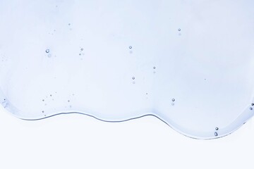 Cream gel gray blue transparent cosmetic sample texture with bubbles blue mirror background