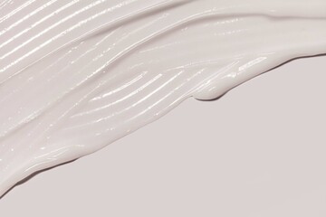 Cosmetic cream gel on light gray background diagonal swatch