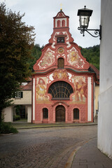 View of the traditional painted bavarian church of the holy spirit in the village of Fussen, famous travel destination on the Romanic Road of Bavaria, Germany - 545757025