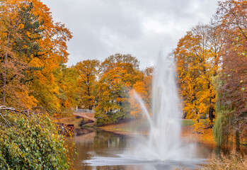 Decorative fountain and water cascade in autumnal  park in Riga, capital city of Latvia