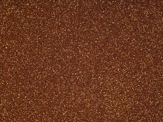 Brown holographic glitter. Abstract shiny background. Design paper texture for decoration and design of Christmas, New Year or other holiday pictures. Beautiful packaging material.