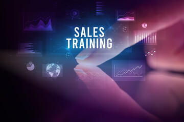 Finger touching tablet with business graphs and icons concept