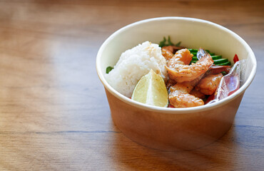 Store-bought poke bowl with shrimp and rice.