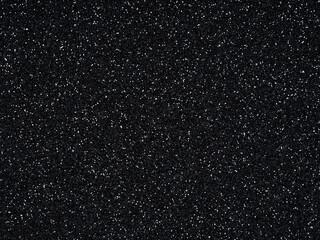 Black sparkling shiny glitter. Design pattern dark texture for decoration and design of unusual, extravagant Christmas, New Year, xmas gift card or other holiday pictures. Beautiful packaging material