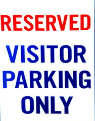 Reserved vistor parking sign.