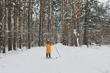 Girl skiing in the forest