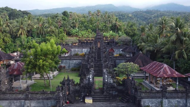 Aerial Beautiful Temple in Bali Surrounded by Forest and Mountain - Pura Puseh Les - Penuktukan Buleleng
