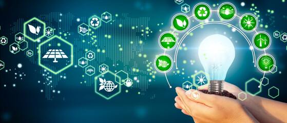Women's hands holding a bulb. Eco concept, ecology, clean energy and environment. Elements of this image furnished by NASA