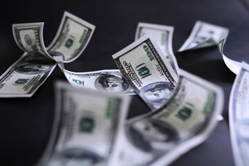 Dollar banknotes flying on black background, collage. Banner design