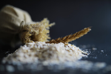 World grain crisis. A handful of cereals and on a dark background.