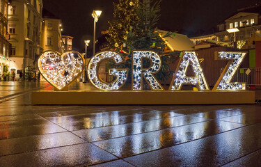 Beautiful Christmas decorations at famous main square Hauptplatz, at night, in the city center of...