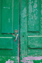 Old, picturesque main front door in mediterranean region house.