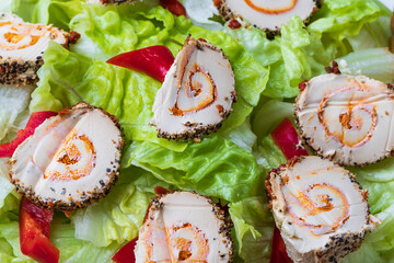 Healthy food. Green lettuce, red pepper, natural cheese on a white plate.