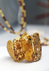 Beautiful amber bracelet on a white shelf
