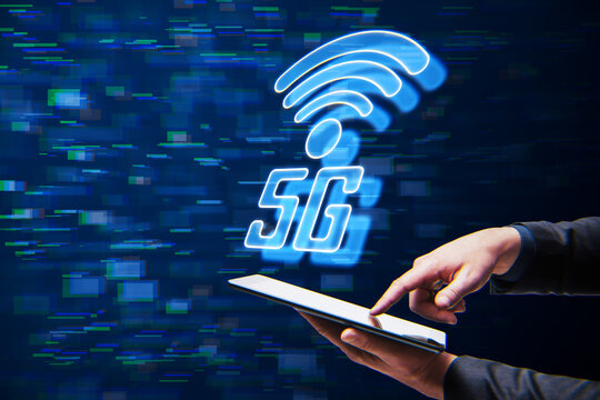 male hand pointing at cellphone with 5G glitchy icon hologram on blurry background. 5th Generation Wireless Internet Network connection information technology illustration.