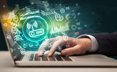 Business hand typing on a modern laptop