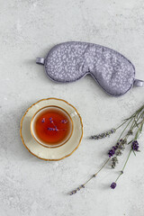Cup tea of lavender with  mask for sleep. Healthy sleep or relax concept 