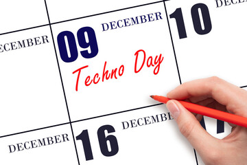 December 9th. Hand writing text Techno Day on calendar date. Save the date.