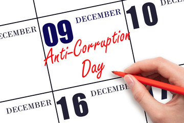 December 9th. Hand writing text Anti-Corruption Day on calendar date. Save the date.