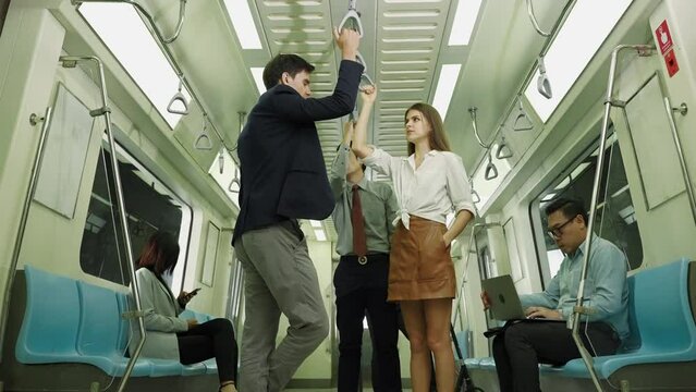 Couples are traveling by subway, a convenient, economical and safe public transport.
