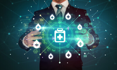 Hand holding healthcare icons concept