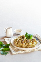 Portion of mushrooms, shallot and celery risotto