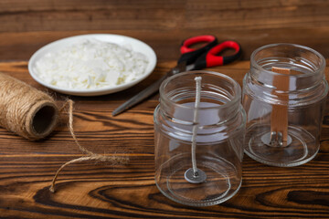 Ecological and vegan handmade soy wax candles with wooden wick. Transparent container, essential oil, soy wax, matches and dried flowers. MOCKUP, space for text. Handmade craft candles.