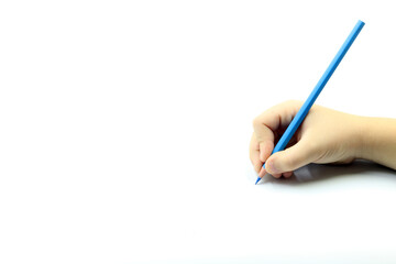 Child holding a blue pencil or paint