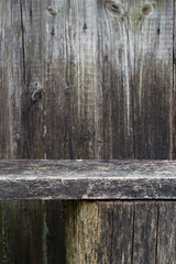 vertical wooden background with  weathered bench near wall