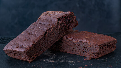 brownie on a stone on a black background