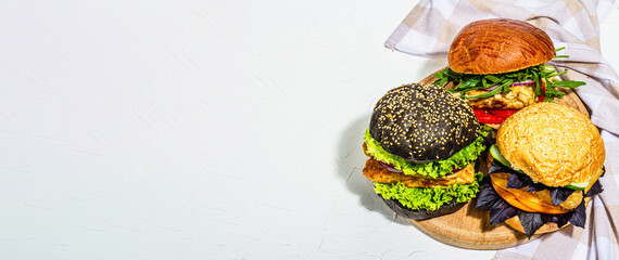 Set of homemade fish burgers. Fresh ingredients, ripe vegetables, fast food concept