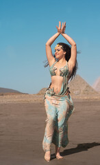 A bellydance dancer dancing at the egyptian pyramids concept edited