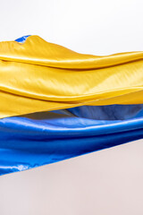 Shiny satin fabrics with the colors of the flag of Ukraine and a white background