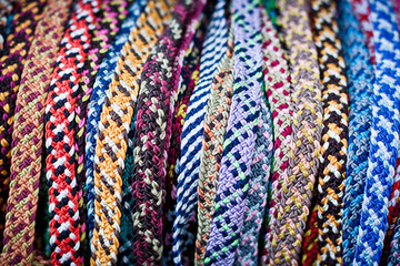 Braided colorful rope friendship bracelets handmade background