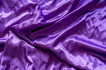Satin texture fabric with shiny purple waves