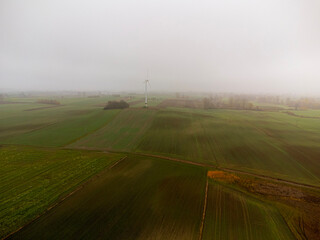 Wind turbine in the fog, alternative energy