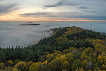 Fototapeta na wymiar Panoramic view on the Odenwald near Lampenhain and Fog over the Rhine Valley in Germany.