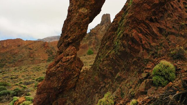 Flying a drone through a natural rock hole. Queen Shoe Teide National Park Tenerife Spain. Volcanic mountain rock formation. Deserted hiking area. Canary Island.