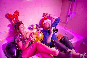Couple drinking champagne at New Year party midnight countdown