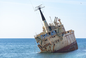 A large cargo ship that ran aground in the Sea Caves area of Paphos County, near Coral Bay, during...