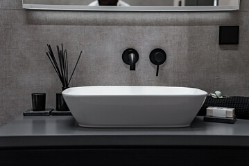 Modern interior design for home, bathroom, interior details, upholstered furniture against the background of a light classic wall.