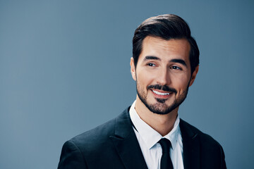 Portrait of a business man with a natural smile with teeth on a blue background in a business suit. Business portrait of a stylish man copy space