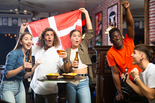 Danish fans scream with joy in a beer bar. Denmark win