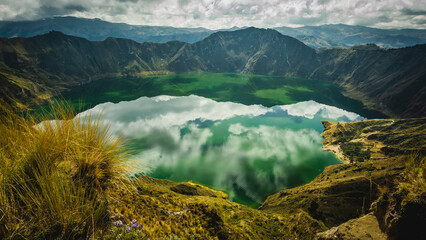 Aerial view of Quilotoa Volcano Crater in Ecuador. The extinct volcano is filled with water and is a popular tourist destination. © Michele