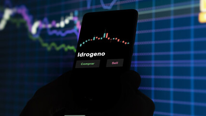 Un inversor está analizando el idrogeno etf fondo en pantalla. Un teléfono muestra los precios...